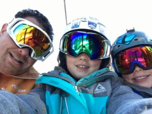 Buck and his family skiing together