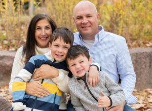 A family photo of Lindsey, her husband, and their two young boys.