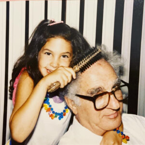 Lindsey as a child, combing her Grandpa's hair.